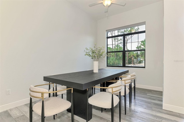 2546 Malibu Ln, North Port, FL 34286 - dining room with baseboards, light wood-style flooring, and ceiling fan