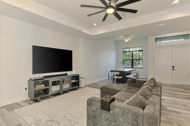 2546 Malibu Ln, North Port, FL 34286 - living area featuring wood finished floors, ceiling fan, ornamental molding, baseboards, and a raised ceiling