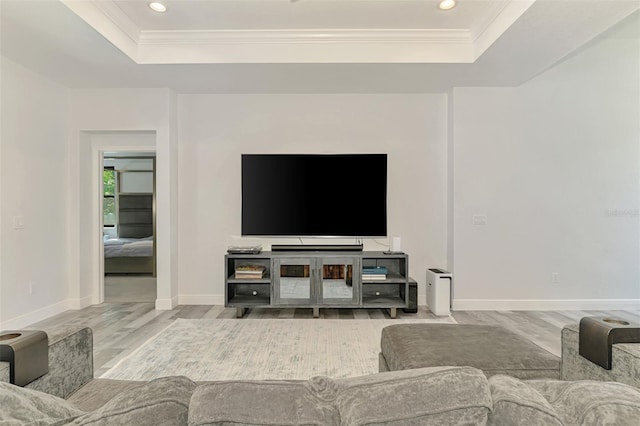 2546 Malibu Ln, North Port, FL 34286 - living room with a tray ceiling, wood finished floors, ornamental molding, recessed lighting, and baseboards