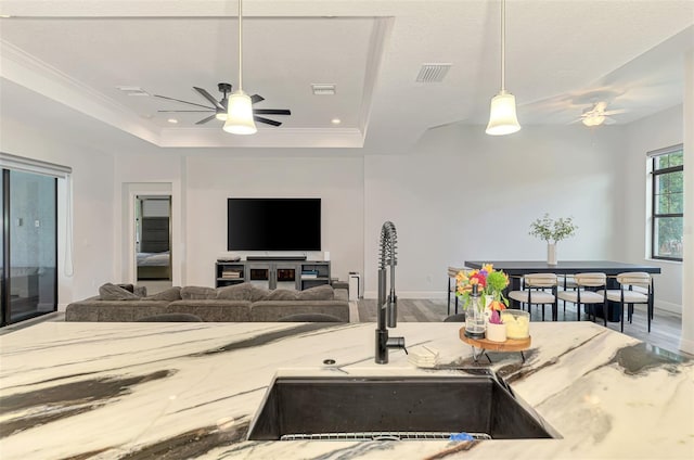 2546 Malibu Ln, North Port, FL 34286 - kitchen featuring a ceiling fan, a sink, decorative light fixtures, a raised ceiling, and recessed lighting