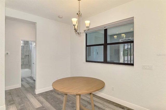 2546 Malibu Ln, North Port, FL 34286 - sitting room with wood finished floors, baseboards, and a chandelier
