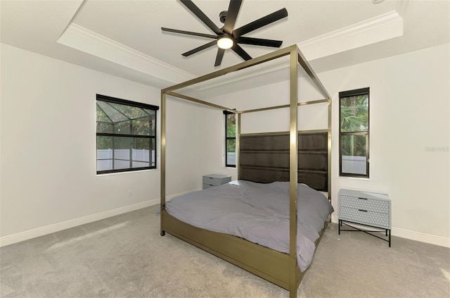 2546 Malibu Ln, North Port, FL 34286 - carpeted bedroom featuring ornamental molding, baseboards, a tray ceiling, and a ceiling fan