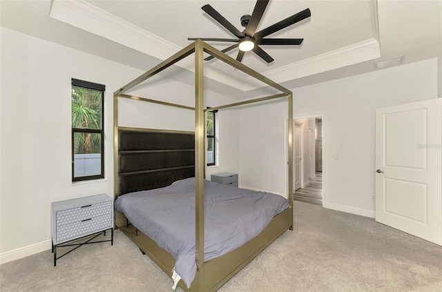 2546 Malibu Ln, North Port, FL 34286 - carpeted bedroom featuring ornamental molding, baseboards, a tray ceiling, and ceiling fan