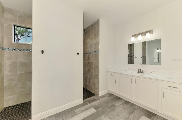 2546 Malibu Ln, North Port, FL 34286 - full bath with a walk in shower, vanity, wood finished floors, and baseboards