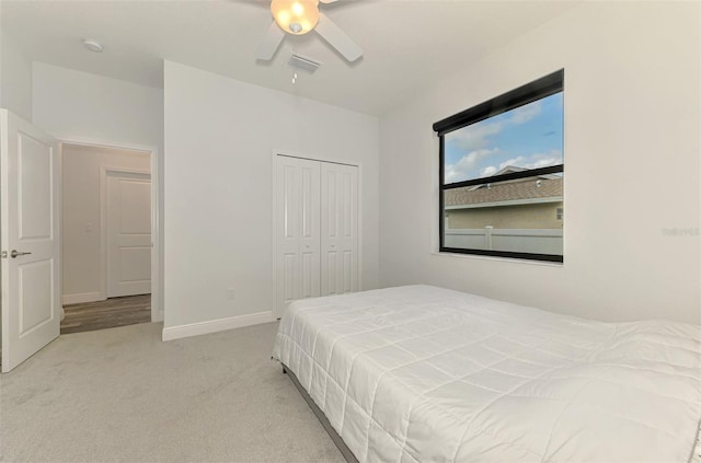 2546 Malibu Ln, North Port, FL 34286 - carpeted bedroom featuring a closet, a ceiling fan, and baseboards
