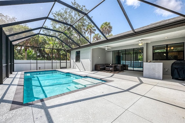 2546 Malibu Ln, North Port, FL 34286 - view of swimming pool featuring a patio, ceiling fan, an outdoor living space, glass enclosure, and a grill