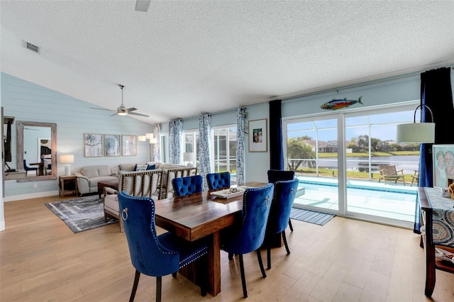 4120 51st Dr W, Bradenton, FL 34210 - dining space with light wood finished floors, a textured ceiling, ceiling fan, and lofted ceiling