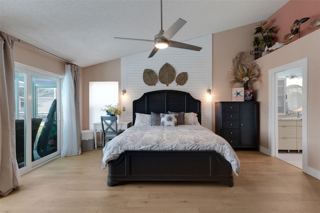 4120 51st Dr W, Bradenton, FL 34210 - bedroom with lofted ceiling, light wood-type flooring, a textured ceiling, ceiling fan, and ensuite bath