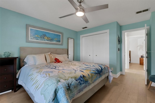 4120 51st Dr W, Bradenton, FL 34210 - bedroom featuring light wood-style floors, a closet, and a ceiling fan