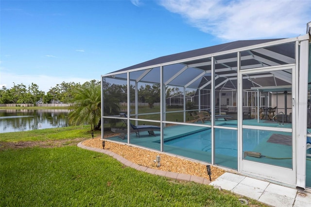 4120 51st Dr W, Bradenton, FL 34210 - swimming pool featuring a water view, a yard, glass enclosure, and a patio area