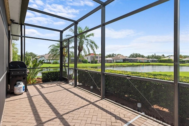 7513 Coventry Ct, Lakewood Ranch, FL 34202 - unfurnished sunroom featuring a water view and a residential view