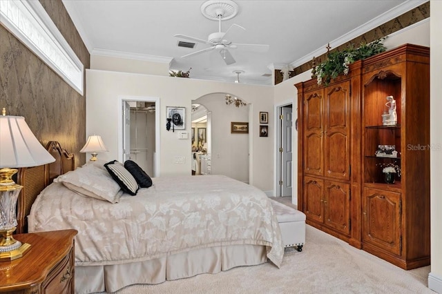7513 Coventry Ct, Lakewood Ranch, FL 34202 - bedroom featuring arched walkways, light colored carpet, crown molding, a closet, and a ceiling fan