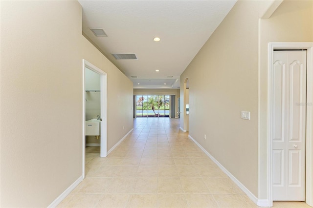 8772 Stone Harbour Loop, Bradenton, FL 34212 - corridor featuring recessed lighting and light tile patterned flooring