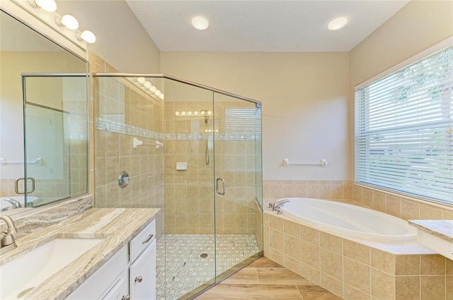8772 Stone Harbour Loop, Bradenton, FL 34212 - full bathroom featuring a garden tub, vanity, and a stall shower