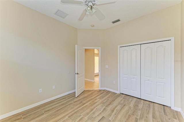 8772 Stone Harbour Loop, Bradenton, FL 34212 - unfurnished bedroom with light wood-type flooring, a closet, and a ceiling fan