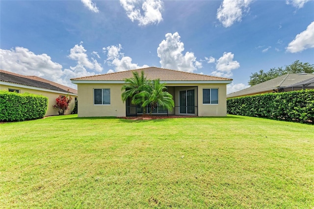 8772 Stone Harbour Loop, Bradenton, FL 34212 - rear view of property with a tiled roof, stucco siding, and a lawn