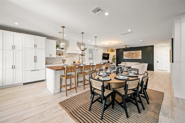 109 Palmetto Ave, Anna Maria, FL 34216 - dining room with recessed lighting and light wood-style floors