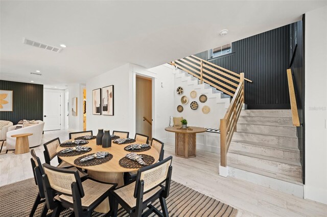109 Palmetto Ave, Anna Maria, FL 34216 - dining area with stairs, light wood finished floors, and recessed lighting