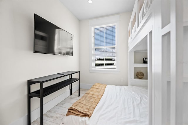 109 Palmetto Ave, Anna Maria, FL 34216 - bedroom with baseboards and wood finished floors
