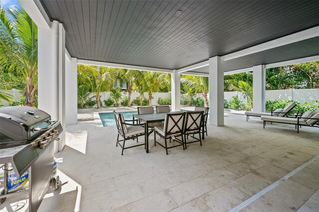 109 Palmetto Ave, Anna Maria, FL 34216 - fenced backyard with outdoor dining space and a patio area