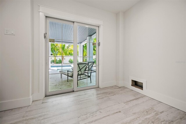 109 Palmetto Ave, Anna Maria, FL 34216 - spare room featuring baseboards and wood finished floors