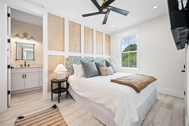 109 Palmetto Ave, Anna Maria, FL 34216 - bedroom with light wood-style flooring, ensuite bathroom, a sink, recessed lighting, and ceiling fan