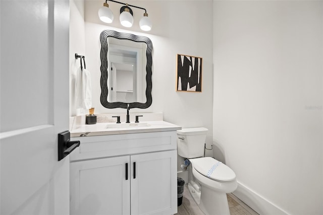 109 Palmetto Ave, Anna Maria, FL 34216 - half bath with toilet, vanity, and baseboards