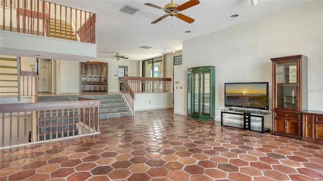 222 Beach Rd Unit 7, Sarasota, FL 34242 - unfurnished living room with a ceiling fan and stairway