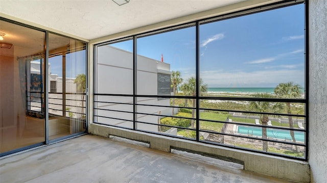 222 Beach Rd Unit 7, Sarasota, FL 34242 - unfurnished sunroom featuring a water view