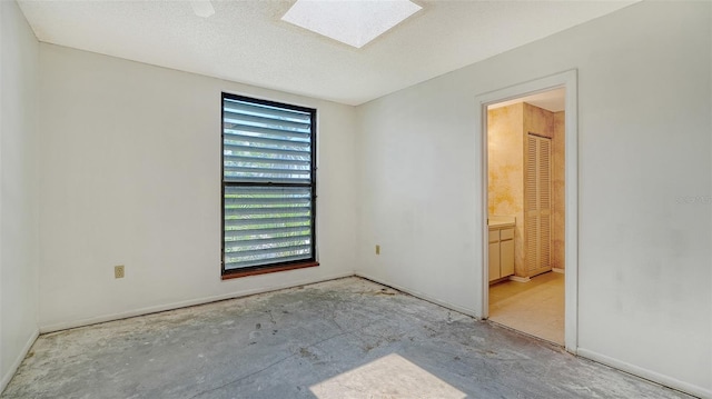 222 Beach Rd Unit 7, Sarasota, FL 34242 - spare room with a skylight