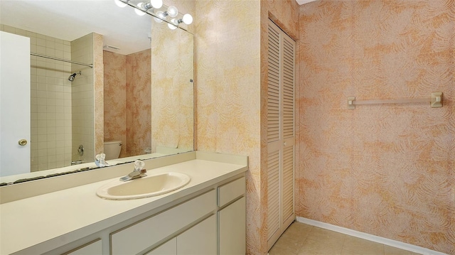 222 Beach Rd Unit 7, Sarasota, FL 34242 - bathroom featuring vanity, a closet, wallpapered walls, tile patterned flooring, and a shower