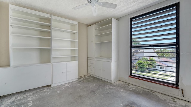 222 Beach Rd Unit 7, Sarasota, FL 34242 - unfurnished room with concrete floors, a textured ceiling, healthy amount of natural light, and a ceiling fan
