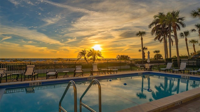 222 Beach Rd Unit 7, Sarasota, FL 34242 - pool at dusk featuring a community pool