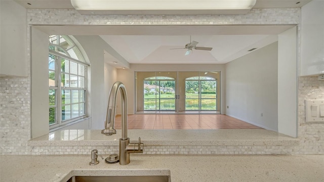 3317 Highlands Bridge Rd Unit 61, Sarasota, FL 34235 - kitchen with plenty of natural light, ceiling fan, and backsplash