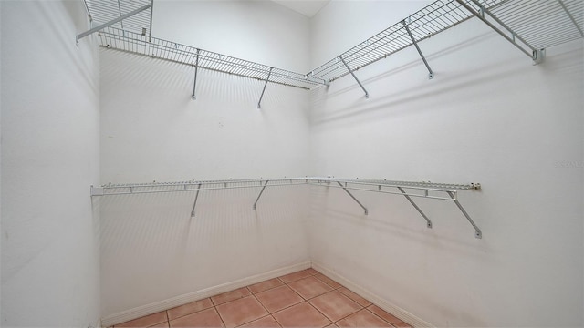 3317 Highlands Bridge Rd Unit 61, Sarasota, FL 34235 - spacious closet featuring light tile patterned floors