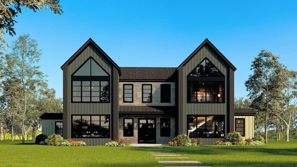 2716 Delphi Hills Way, Lakeland, FL 33812 - view of front of house with a front lawn, board and batten siding, a shingled roof, and a standing seam roof