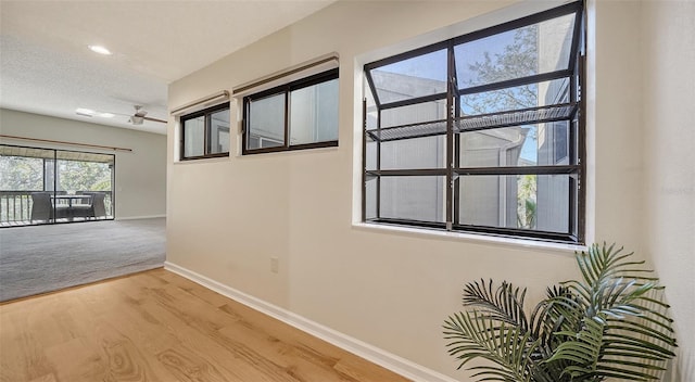 137 Woodland Pl, Osprey, FL 34229 - hall with wood finished floors and recessed lighting