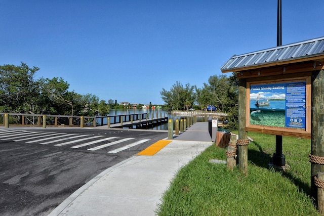 137 Woodland Pl, Osprey, FL 34229 - view of community featuring a water view, a boat dock, and uncovered parking