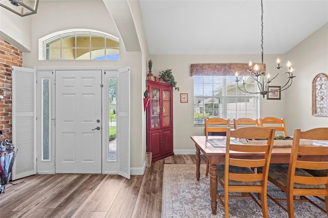 743 Stonecrest Dr, Sarasota, FL 34232 - foyer with a chandelier, wood finished floors, and baseboards