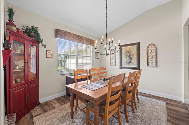 743 Stonecrest Dr, Sarasota, FL 34232 - dining space featuring lofted ceiling, a chandelier, baseboards, and dark wood finished floors