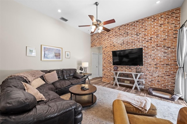 743 Stonecrest Dr, Sarasota, FL 34232 - living room featuring ceiling fan, wood finished floors, recessed lighting, and brick wall