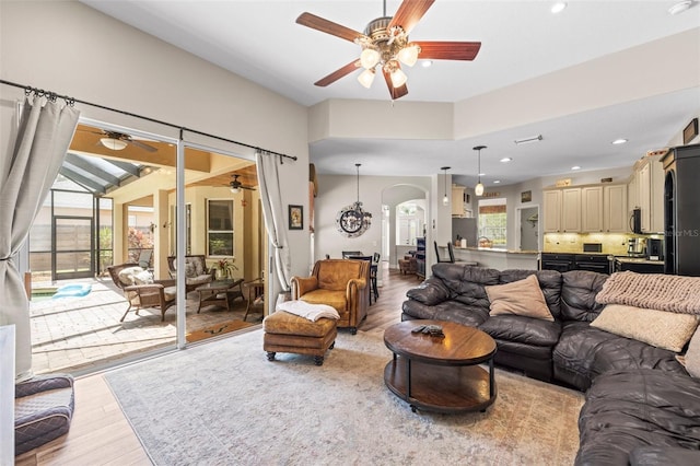 743 Stonecrest Dr, Sarasota, FL 34232 - living area with a ceiling fan, light wood-style floors, arched walkways, and recessed lighting