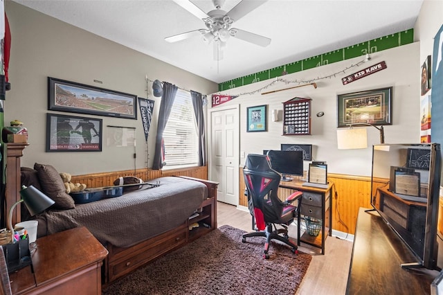 743 Stonecrest Dr, Sarasota, FL 34232 - office area featuring wood finished floors, wooden walls, a ceiling fan, and wainscoting