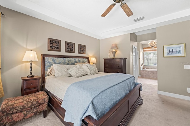 743 Stonecrest Dr, Sarasota, FL 34232 - bedroom with light carpet, a chandelier, baseboards, ensuite bath, and a ceiling fan