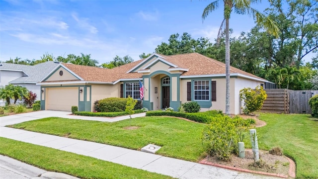 743 Stonecrest Dr, Sarasota, FL 34232 - ranch-style home with an attached garage, stucco siding, driveway, and a shingled roof
