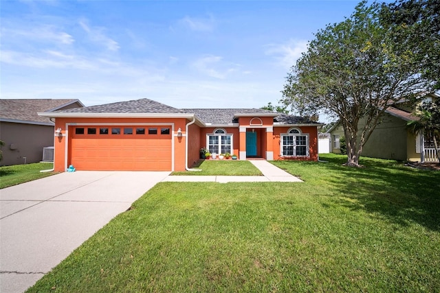 4194 Banbury Cir, Parrish, FL 34219 - ranch-style home featuring a garage, a front lawn, driveway, and stucco siding