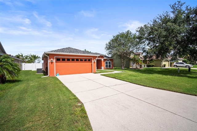 4194 Banbury Cir, Parrish, FL 34219 - ranch-style home with cooling unit, a garage, driveway, and stucco siding