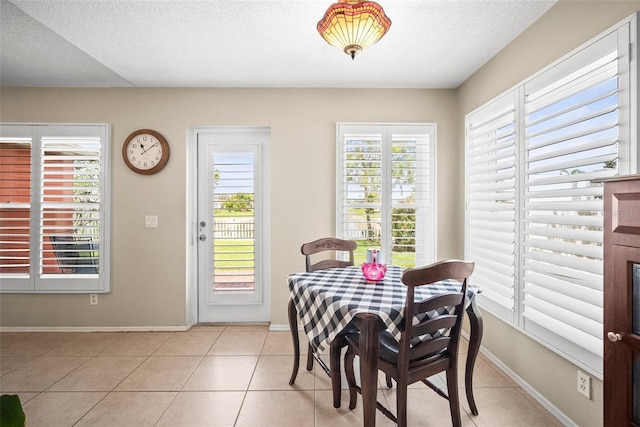 4194 Banbury Cir, Parrish, FL 34219 - dining room with baseboards and light tile patterned floors