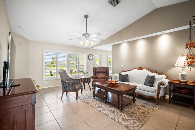 4194 Banbury Cir, Parrish, FL 34219 - living area featuring lofted ceiling, a ceiling fan, light tile patterned flooring, and baseboards