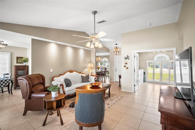 4194 Banbury Cir, Parrish, FL 34219 - living room featuring a chandelier, light tile patterned floors, ceiling fan, and high vaulted ceiling